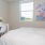 Bedroom with large bed, ensuite. queen bed and nightstands.