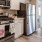 Two Bedroom Apartments in Sparks NV - Waterfront at the Marina - Modern Kitchen Space with Stainless Steel Appliances, White Cabinetry, White Countertops, and Open-Concept Layout